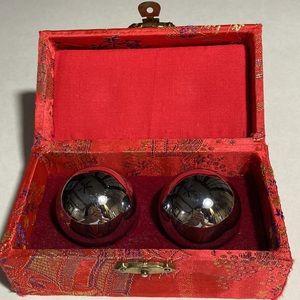 CHINESE IRON BAODING BALLS WITH MUSICAL CHIME IN RED BROCADE BOX